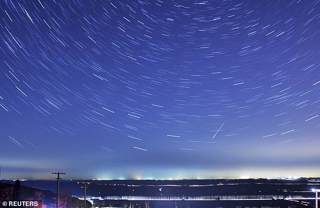 A meteor piercing the stars during the annual quadruple meteor showers in Qingdao, Shandong Province, January 4, 2014.